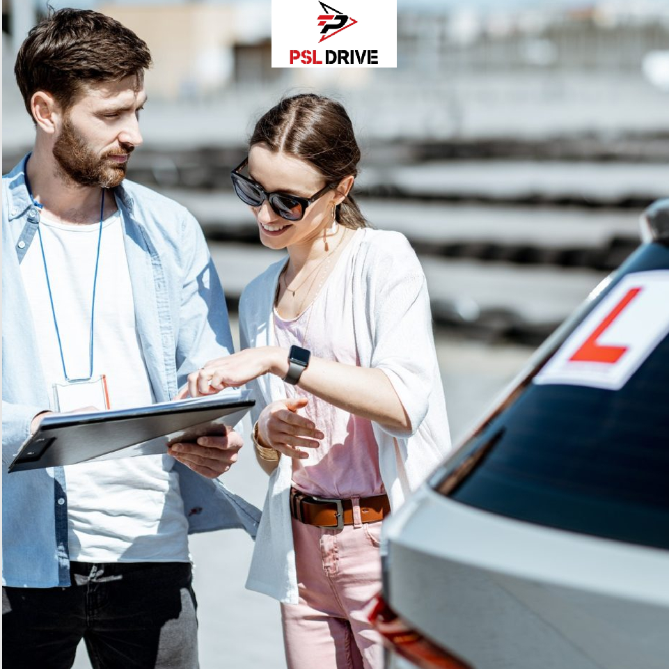 PSL Drive instructor and female learner driver reviewing a lesson on a clipboard next to a training vehicle with an L plate.